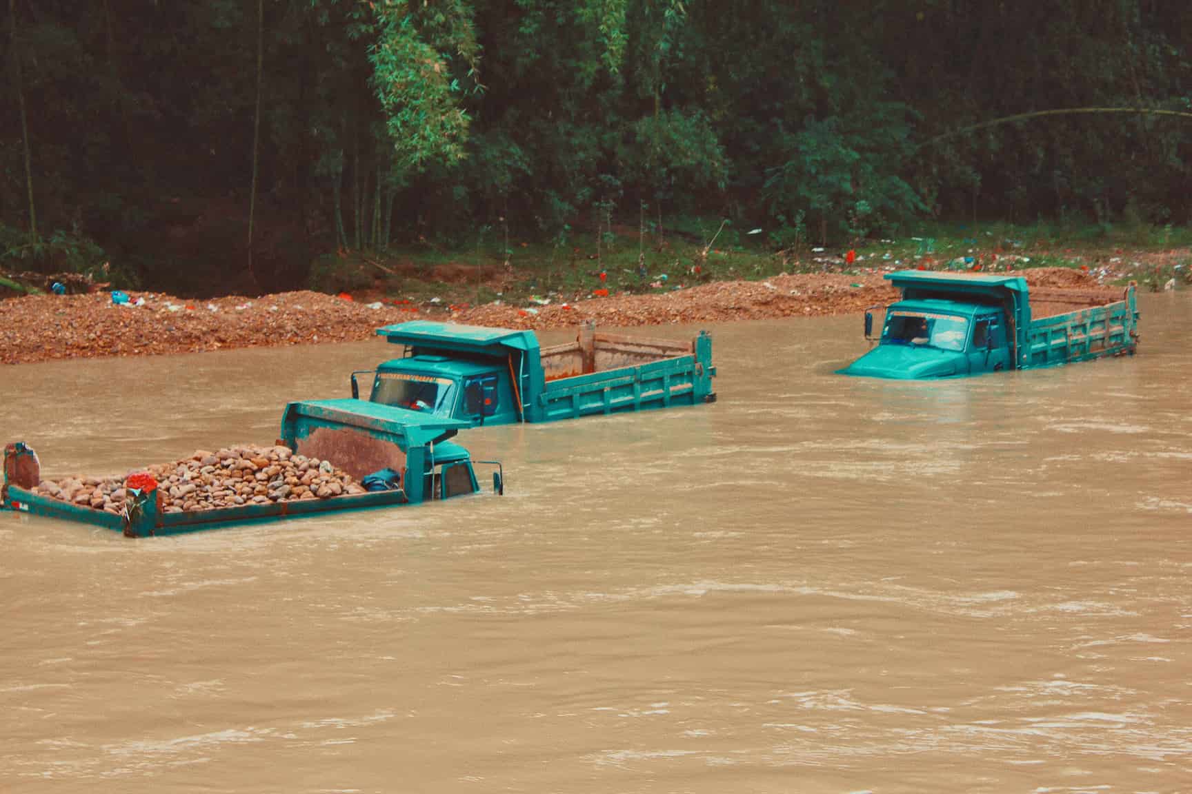 Three trucks under water in a severe flooding