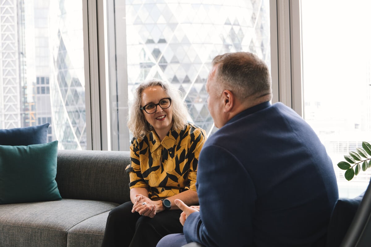 Two Howden colleagues talking
