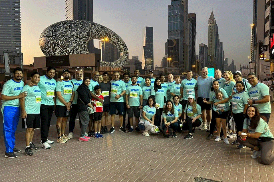 Howden colleagues with Dubai's skyline in the background