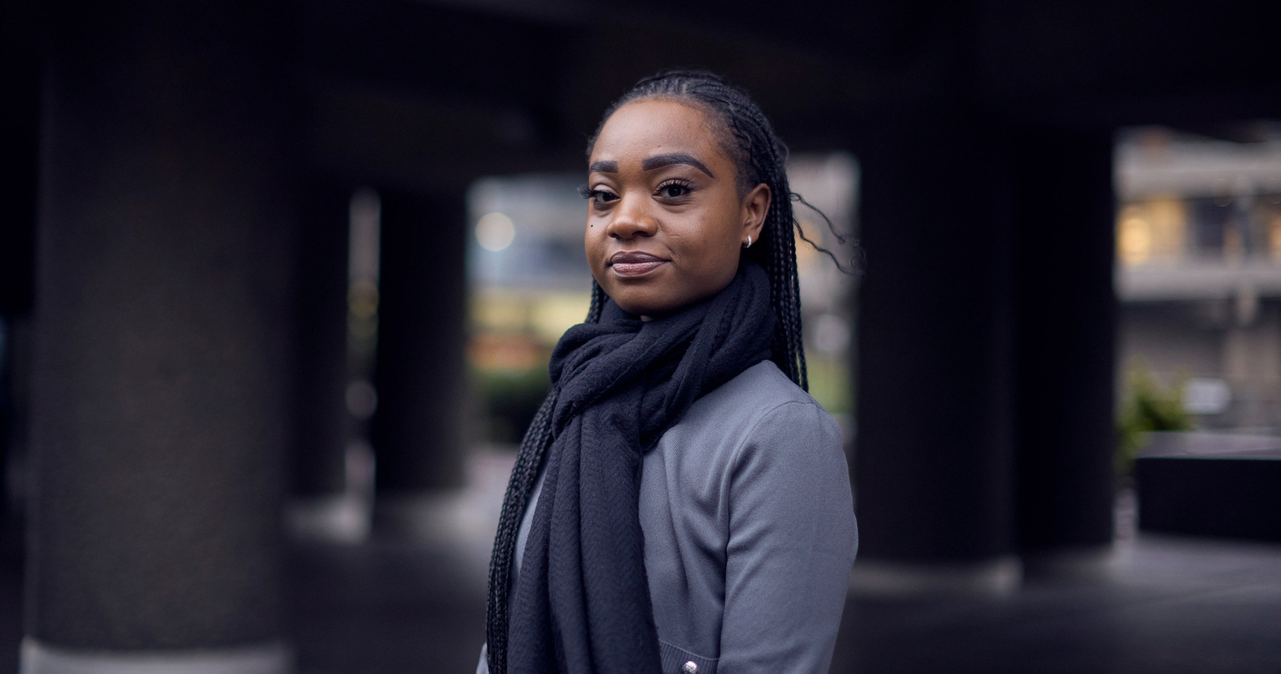 Emer Riziki posing outside the Barbican in London