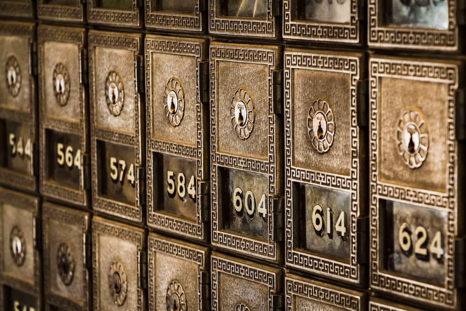 A row of deposit boxes in a bank vault