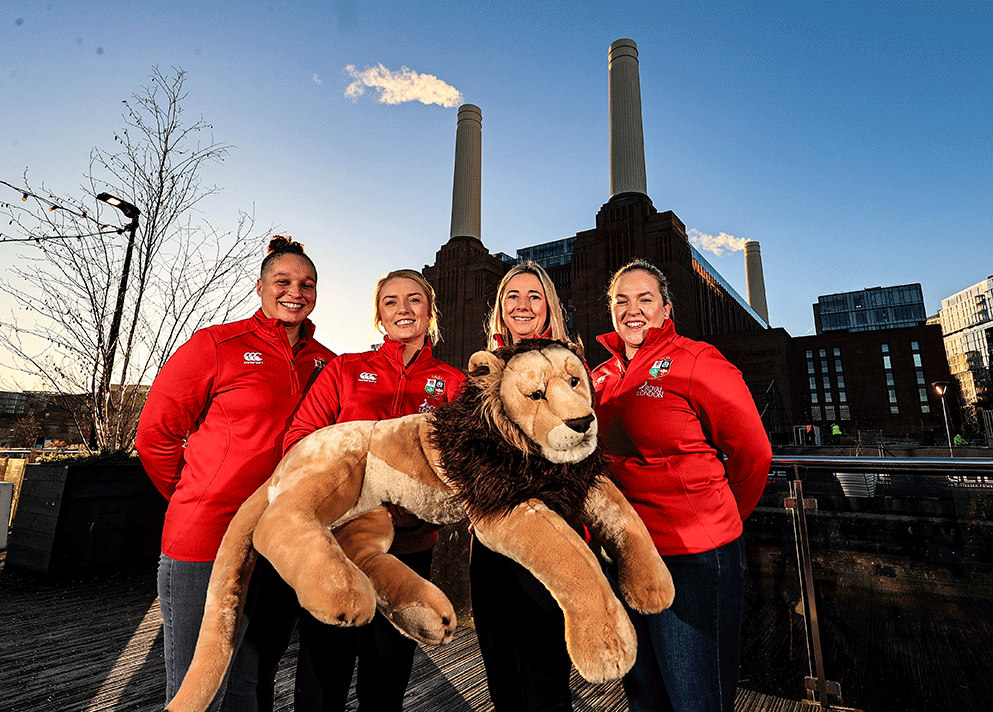Four Lions players with Leo the lion mascot